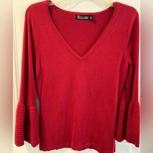 Red V-Neck Sweater with Ribbed Bell Sleeves.
Size Small